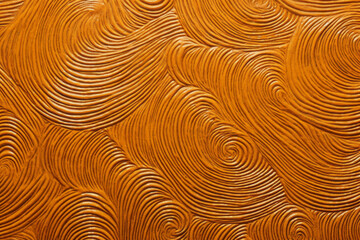 Yuzen cloth material with spiral top design, yellow hues, fabric surface material texture