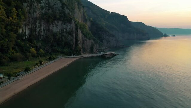 During the unique sunset, the drone approaches the pillars. G&uuml;zelcehisar Lava Columns, Bartin.