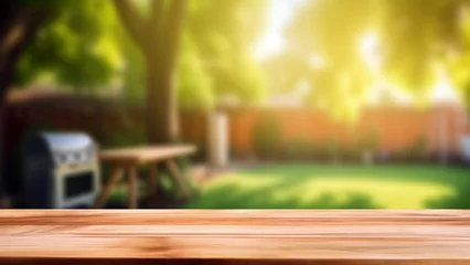 Fotobehang Wooden table top on blur garden home bbq background. Perfect for display or montage your products. High quality photo © oksa_studio