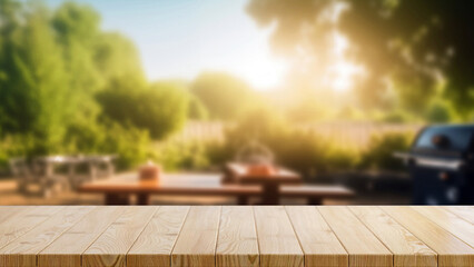 Empty wooden table and blurred bbq in the backyard background, for product display montage. High quality photo - obrazy, fototapety, plakaty