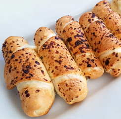 Delicious baked cheese rolls, baked crunchy cheese bread on an catering event, selected focus, cheese wrapped in bread and baked