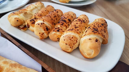 Delicious baked cheese rolls, baked crunchy cheese bread on an catering event, selected focus, cheese wrapped in bread and baked