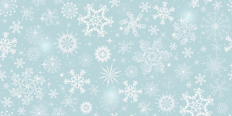 Vector gentle seamless Christmas pattern with white snowflakes on blue a background