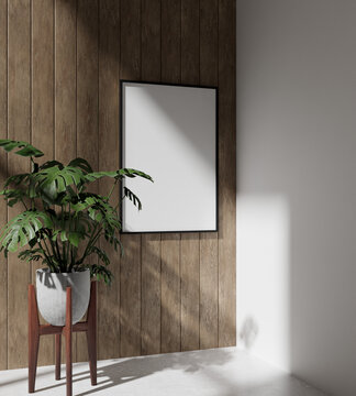 single wooden frame mockup poster hanging on the wooden wall with plant decor. shot from wide angle.