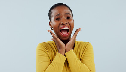 Happy black woman, portrait and face in surprise for winning, prize or celebration against a studio...