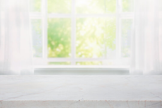 Fototapeta Selective focus.Elegance product display background with marble top with curtain and vine leaf on window garden in morning