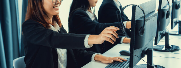 Business people wearing headset working in office to support remote customer or colleague. Call...