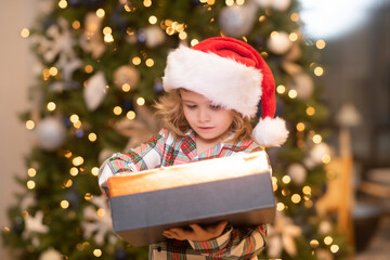 Obraz na płótnie Canvas Child at home on Christmas. Little kid celebrating Christmas or New Year.