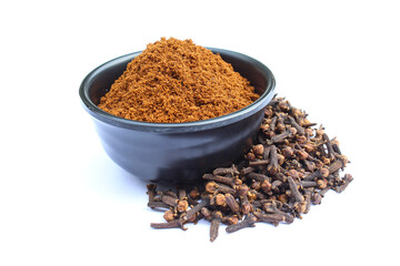 Cloves powder in a bowl on white background close-up view 