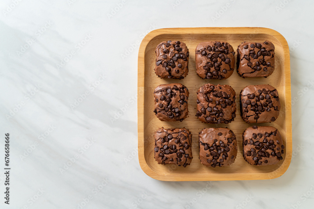 Wall mural dark chocolate brownies topped by chocolate chips