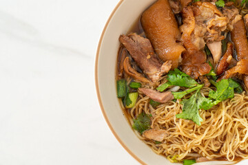 Stewed pork leg noodles in brown soup