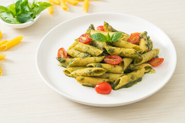 penne pasta with pesto sauce and tomatoes