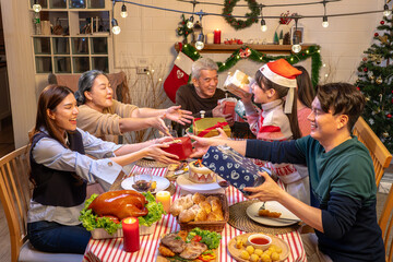 Happy people are celebrating on a table meal when christmas and new year at home.
