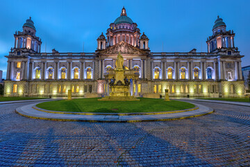 The illuminated Belfast City Hall at dawn