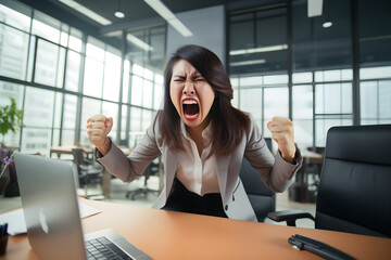 portrait of angry Asian businesswoman in office screaming at camera - obrazy, fototapety, plakaty