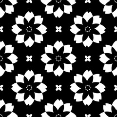Geometric seamless pattern. White flowers on a black background. Black and white vector illustration.