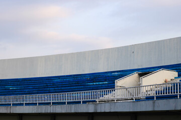 The bleachers or spectator stands are blue and white. stadion. copy space. no body
