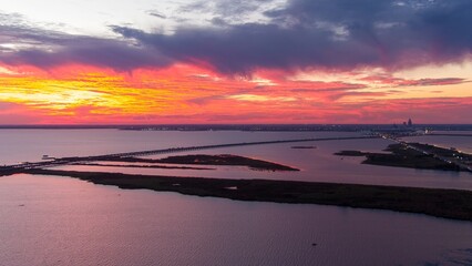 Fototapeta premium Mobile Bay causeway and the Jubilee Parkway bridge at sunset