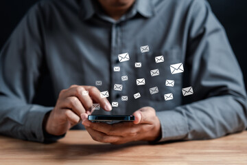 Businessman sending email by laptop computer to customer, business contact and communication, email icon, email marketing concept, send e-mail or newsletter, online working internet network.