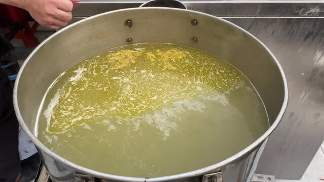 Hot chicken broth that cooked for several hours and used as noodle soup.