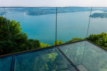 Hotel Five Stars Bürgenstock with Glass Balcony over Lake Lucerne and Mountain in Sunny Day in Bürgenstock, Nidwalden, Switzerland.