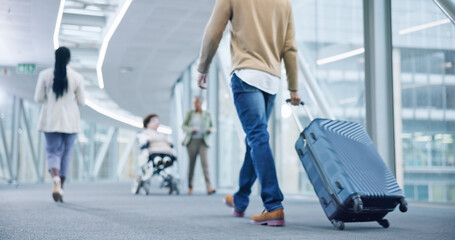 Closeup, walking and man with a suitcase, back and airport to travel, vacation or holiday in...