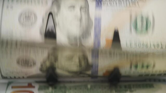 One Hundred Dollar Bill Flow Cash Counting Machine Close Up