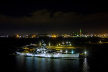 The USS Alabama battleship at night