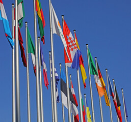 many flags of the states of the world during the intentional meeting and the background of the sky