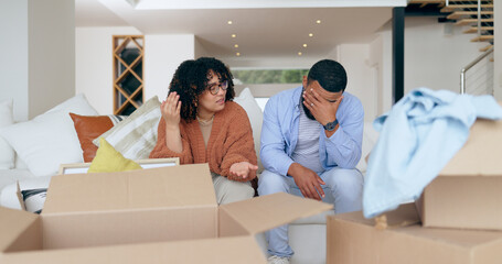 New home, box and frustrated couple on sofa for house, property investment and moving day....