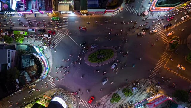 Aerial time-lapse of evening traffic at an intersection in Ho Chi Minh City, Vietnam.