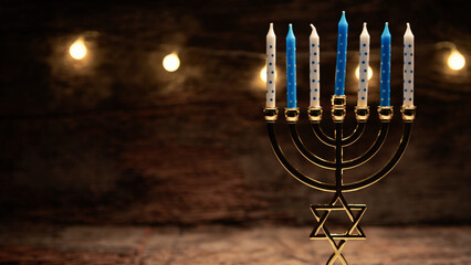 Hanukkah candles on a candlestick copy space
