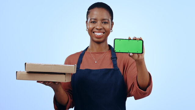 Black Woman, Food Delivery And Smartphone With Smile, Portrait And Chromakey On Blue Studio Background. Waitress, Technology And Online For Order, Communication And Worker For Pizza, Apron Or Service