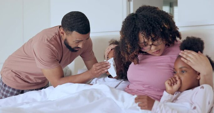 Family, sick children in bed and blowing nose, flu and allergy, virus or bacteria in winter at home. Mother, father and kids with cold in bedroom, tissue or germs and parents care, support and health