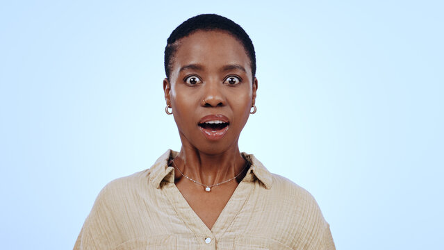 Woman, portrait and surprised in studio for announcement, notification or overwhelmed on blue background. Black person, face and shocked with wow expression for gossip, surprise or secret on mock up - Powered by Adobe