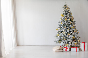 christmas tree with gifts white room new year