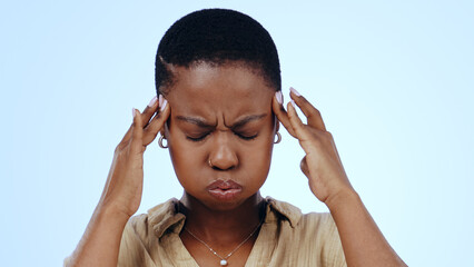 Woman, headache and stress in studio for pain dizzy, anxiety fatigue on blue background. Black...