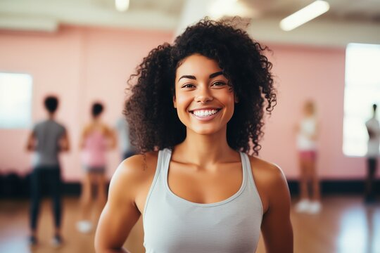 Diverse collection of individuals from different cultures working out in fitness studio. Smiling people from various cultural communities come to exercise in fitness studio showing diversity