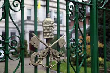 The Vatican’s coat of arms, on the gate of the Vatican’s embassy in the UK – officially the Apostolic Nunciature to Great Britain, in Wimbledon, London