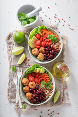 Energetic Mexican salad with meatballs, beans, groats and pepper.
