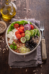 Healthy Greek salad with buckwheat groats as fit food.