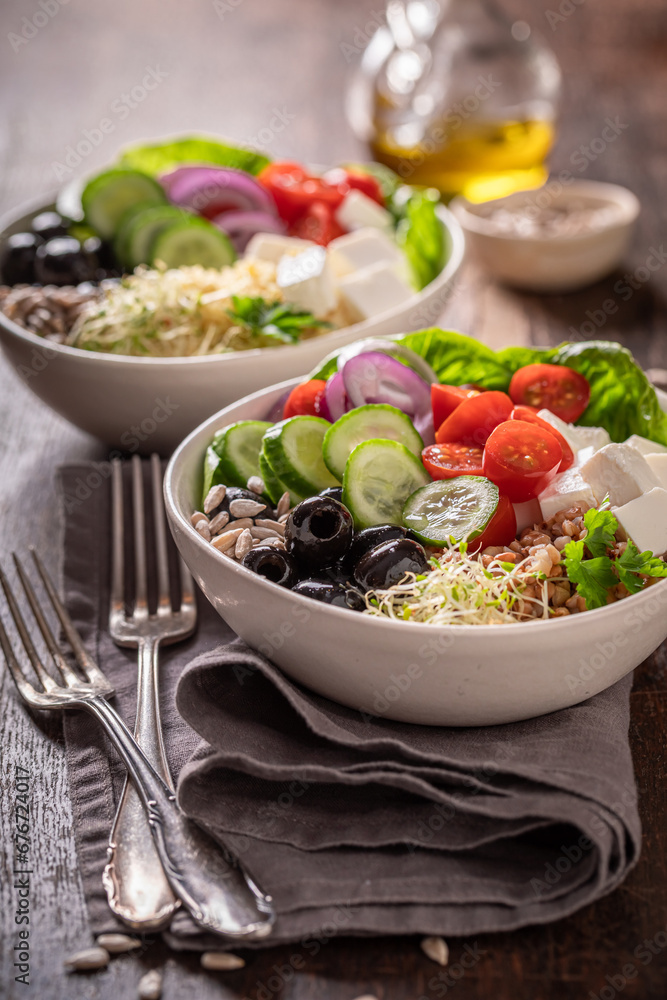 Wall mural fresh greek salad with buckwheat groats as fit food.