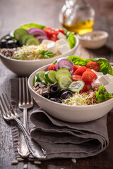 Fresh Greek salad with buckwheat groats as fit food.