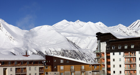 Snowy hotels in winter mountains at nice day © BSANI