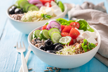 Diet Greek salad with buckwheat groats as fit food.