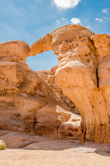 View at the rock formation Frouth Rock Arch in Wadi Rum desert valley, Jordan