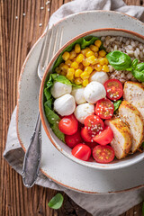 Healthy Caesar salad with groats as fit food.