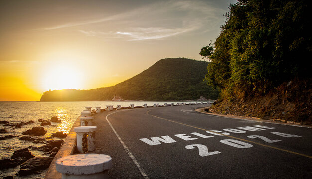 New year 2024. Text of 2024 has written on the ground in the hightlight of the evening sunset.
