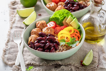 Healthy Mexican salad with vegetables, buckwheat groats and meatballs.