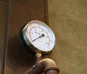 Pressure gauge meter in manufacturing plant.
